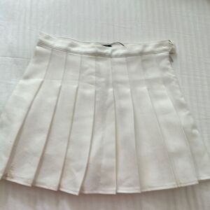 Zeagoo cream cheerleading skirt.
